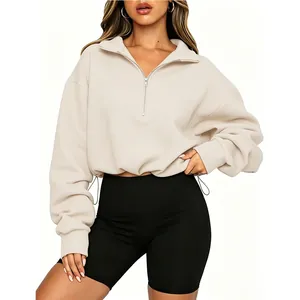 Stylish women's cream half-zip cropped sweatshirt featuring an adjustable drawstring waist