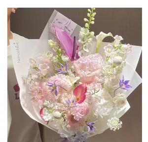 Detailed view of frosted translucent floral wrapping paper on a pink bouquet