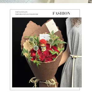 Close-up detail of handmade brown textured paper wrapping a romantic red rose bouquet