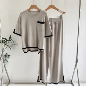 Casual knitted two-piece set featuring short-sleeve top and wide-leg trousers in beige
