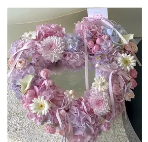 Close-up detail of a romantic heart-shaped floral wreath with an integrated center mirror