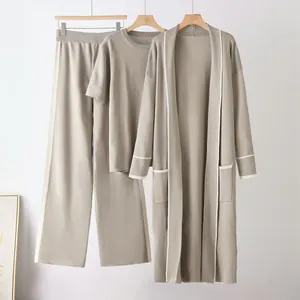 Three-piece women's knit lounge set featuring long cardigan, top, and wide-leg pants.