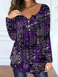 Detail of a women's purple paisley long-sleeved top with V-neck and button accents