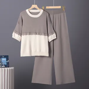 Elegante conjunto de punto de dos piezas con top color block y pantalón de pernera ancha