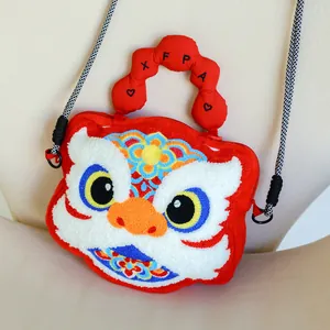 A detailed view of this cute plush lion dance crossbody bag with intricate embroidery.