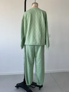 Rear view of light green cable knit two-piece tracksuit on a mannequin