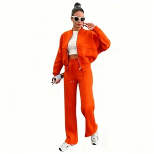 Élégant survêtement deux pièces orange pour femme avec veste zippée et pantalon long