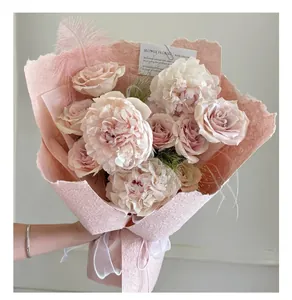 Close-up detail of handmade pink textured petal paper used for elegant flower bouquet wrapping