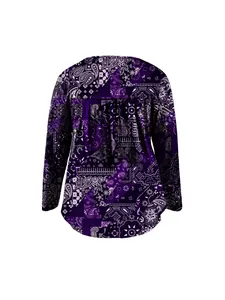 Back view of a long sleeve purple blouse with intricate paisley patchwork pattern