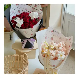 Close-up of polka dot and rose pattern flower bouquet wrapping paper in a lifestyle setting