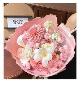 Detailed view of hand-torn pink Dongba paper flower wrapping with unique fiber texture