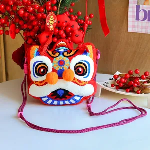 Detail showing a traditional Chinese lion dance plush crossbody bag with colorful embroidery