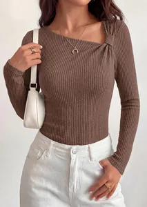 Close-up of brown ribbed long sleeve top with twisted asymmetrical neckline.