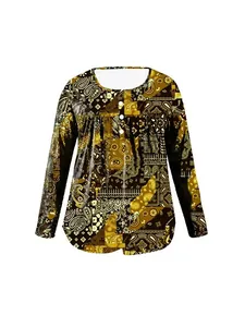 Detail of women's long-sleeve top featuring intricate paisley patterns and button accents.