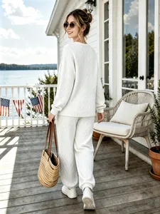 Casual white cable-knit two-piece set with long sleeve top and jogger pants for women