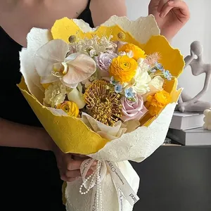 Artistic hand-textured Dongba wrapping paper for flower bouquets in yellow and white