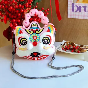 Detailed view of cute plush lion dance crossbody bag with embroidered festive patterns and strap
