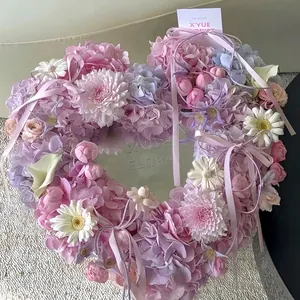 Romantic heart-shaped floral arrangement with center mirror, pink hydrangeas and white gerberas