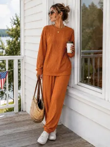 Casual orange cable knit two-piece set featuring long sleeve top and jogger pants for fall.