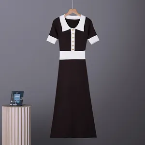 Detail of French retro color-block knit polo dress with contrast white collar