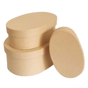 Set of 3 oval kraft paper gift boxes for bakery packaging and wedding favors on white.