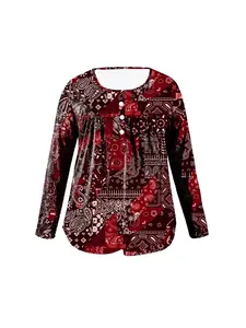 Detailed front view of a red paisley long sleeve top with white buttons and loose fit.