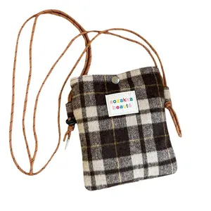 Fashionable plaid woolen crossbody bag for women with minimalist winter check design