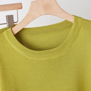 Detailed view of the high-quality ribbed crew neck on a chartreuse knitted sweater for women