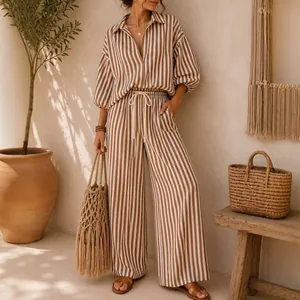Detail view of a stylish two-piece striped vacation set with shirt and wide-leg pants