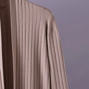 Macro view showing the soft ribbed texture of this mauve women's knit cardigan.