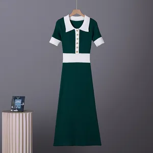 Vintage French style dark green knit polo dress with white contrast collar and gold buttons.