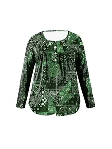 Front view of green paisley printed women's long sleeve top with buttoned round neck