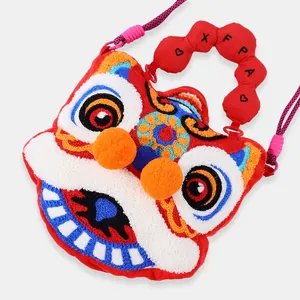 Detailed close-up of vibrant lion dance plush handbag with embroidered textures