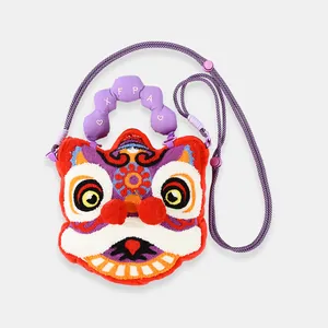 Detailed view of a cute red plush lion dance crossbody bag with a purple handle.
