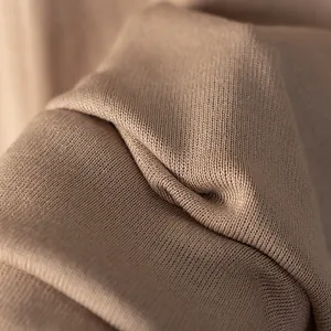 Vista macro de la textura de tejido de punto topo de calidad con costuras finas