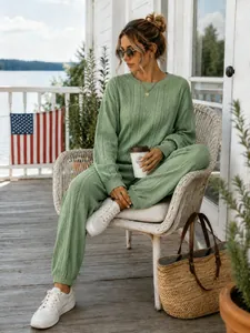 Lifestyle detail of a chic sage green cable knit two-piece lounge set for women