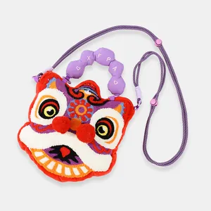 Detailed view of a cute plush lion dance crossbody bag with colorful embroidery and pom-poms.