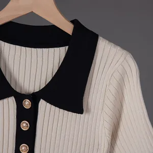 Close-up of contrast polo collar and gold buttons on French vintage knit dress