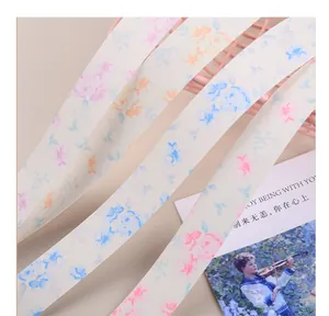Detail view of matte printed floral ribbon for gift wrapping and flower bouquet decor