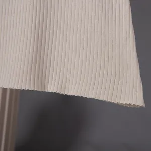 Close-up detail showing the fine ribbed knit texture of this beige French vintage dress