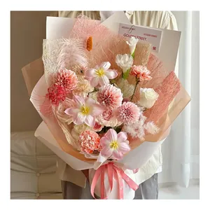 Close-up view of pink artistic mesh and fiber paper for DIY flower bouquet wrapping