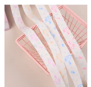Close-up of floral printed matte satin ribbons for elegant gift wrapping and floral decor