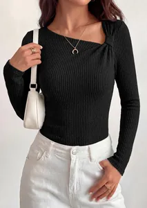 Close-up of black ribbed knit top with asymmetrical knot neckline detail