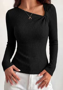 Detailed view of a black ribbed knit long sleeve top with elegant asymmetrical knot neckline