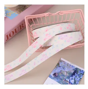 Close-up of elegant floral printed matte ribbon for gift boxes and bouquet packaging