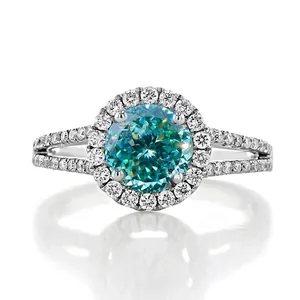 Macro view of a 1-carat cyan moissanite ring with halo setting and split shank design