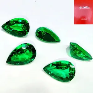 Close-up of pear-shaped hydrothermal lab-grown Colombian emeralds with vibrant green facets