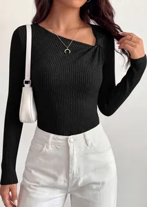 Detail view of women's black ribbed knit long sleeve top with diagonal knot neckline