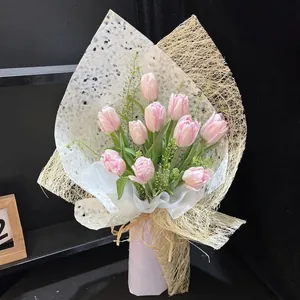 Pink tulip bouquet wrapped in white textured and mesh fiber paper for DIY floristry.