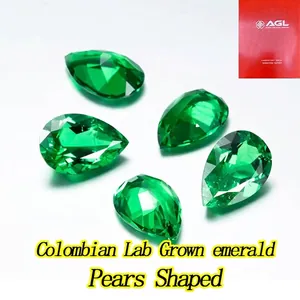 Macro detail of five vibrant pear-shaped lab grown emeralds with multifaceted cuts